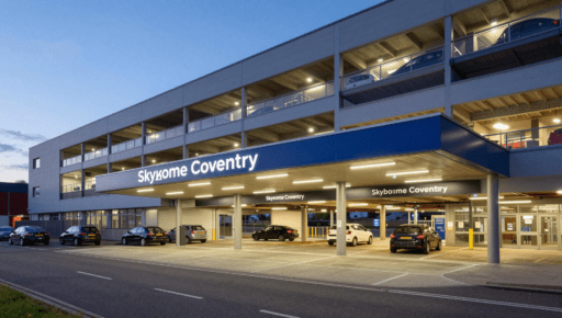 A clear view of the Skydome Car Park Coventry entrance at dusk.